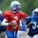 Lincoln quarterback senior Javin Kilgo looks to pass the ball during a practice at the school on Thursday. Melanie Maxwell I AnnArbor.com